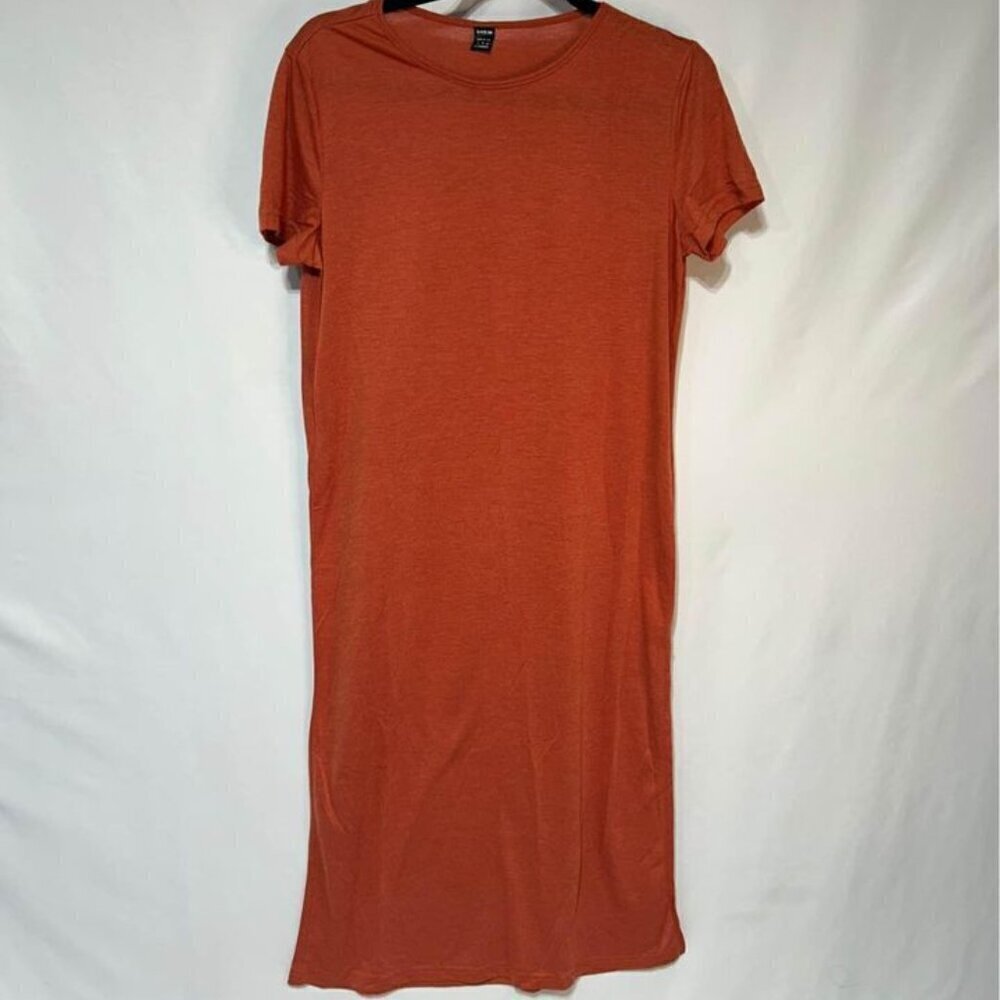 Womans swimsuit cover. Rust in colour. Size M. Crew neck. Slit on one side.